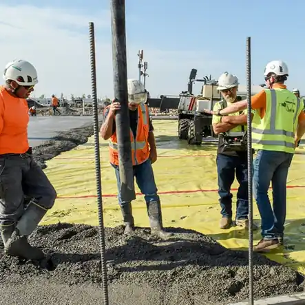 Poppoff crew members placing rebar on a jobsite