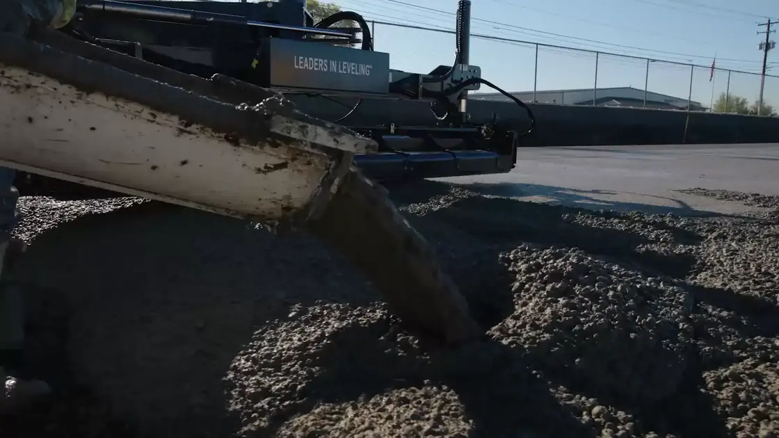A concrete chute pouring into formwork on a Poppoff jobsite